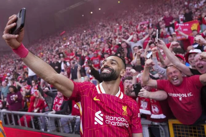 Salah Celebrates Premier League Title with Fans in Selfie
