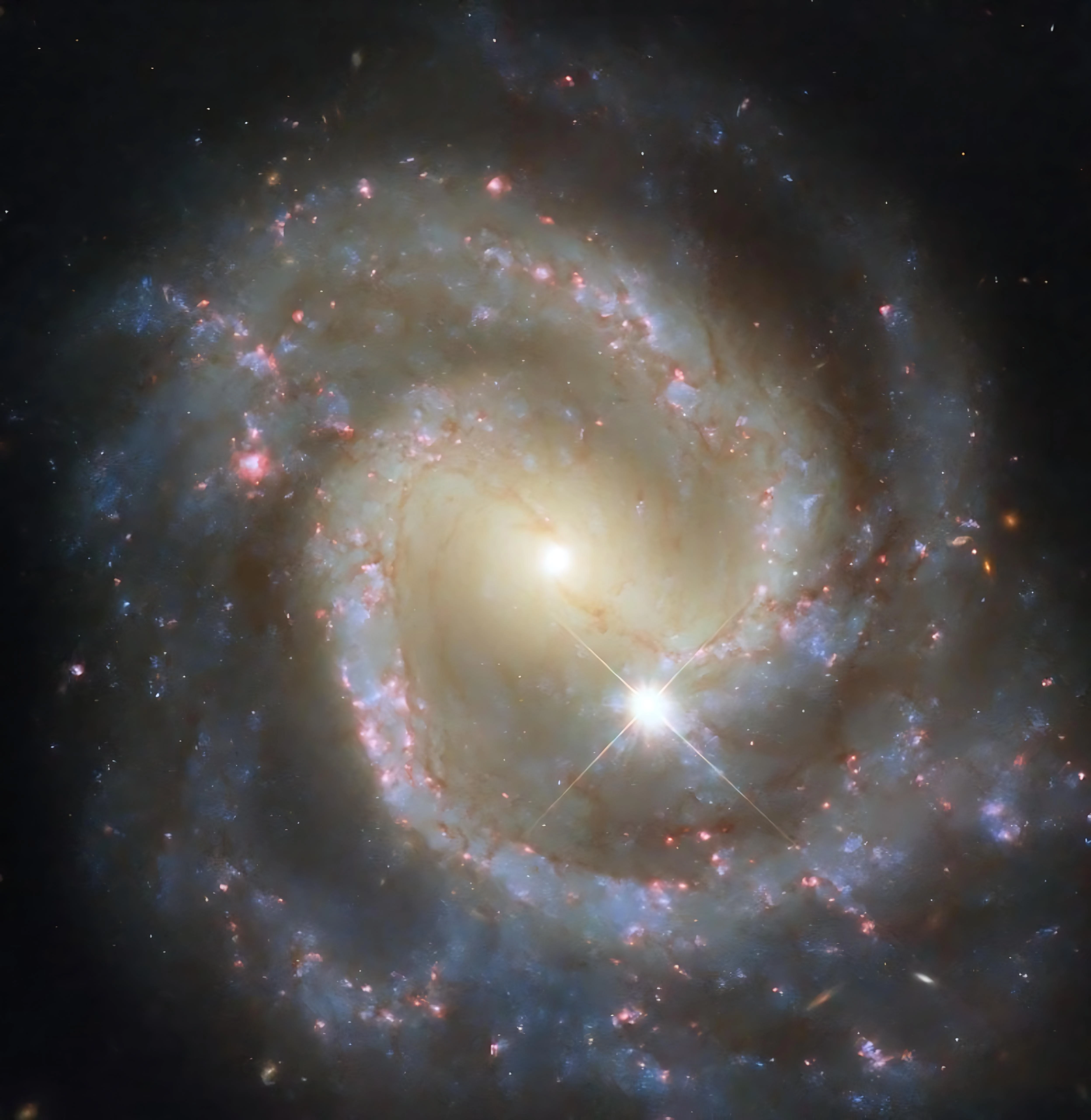 Hubble captures stunning barred spiral galaxy and its cosmic companion