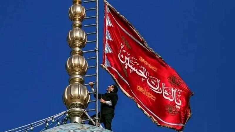Iran raises rare 'flag of revenge' above qom mosque due to rising tensions