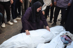 Israeli Air Strikes Kill Palestinian Man and Child in Gaza  during Evacuation